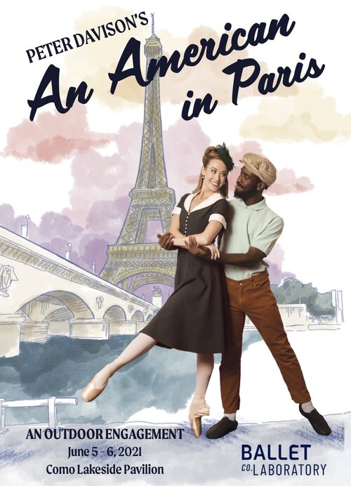 A couple embrace in front of a painting of the Eifel Tower