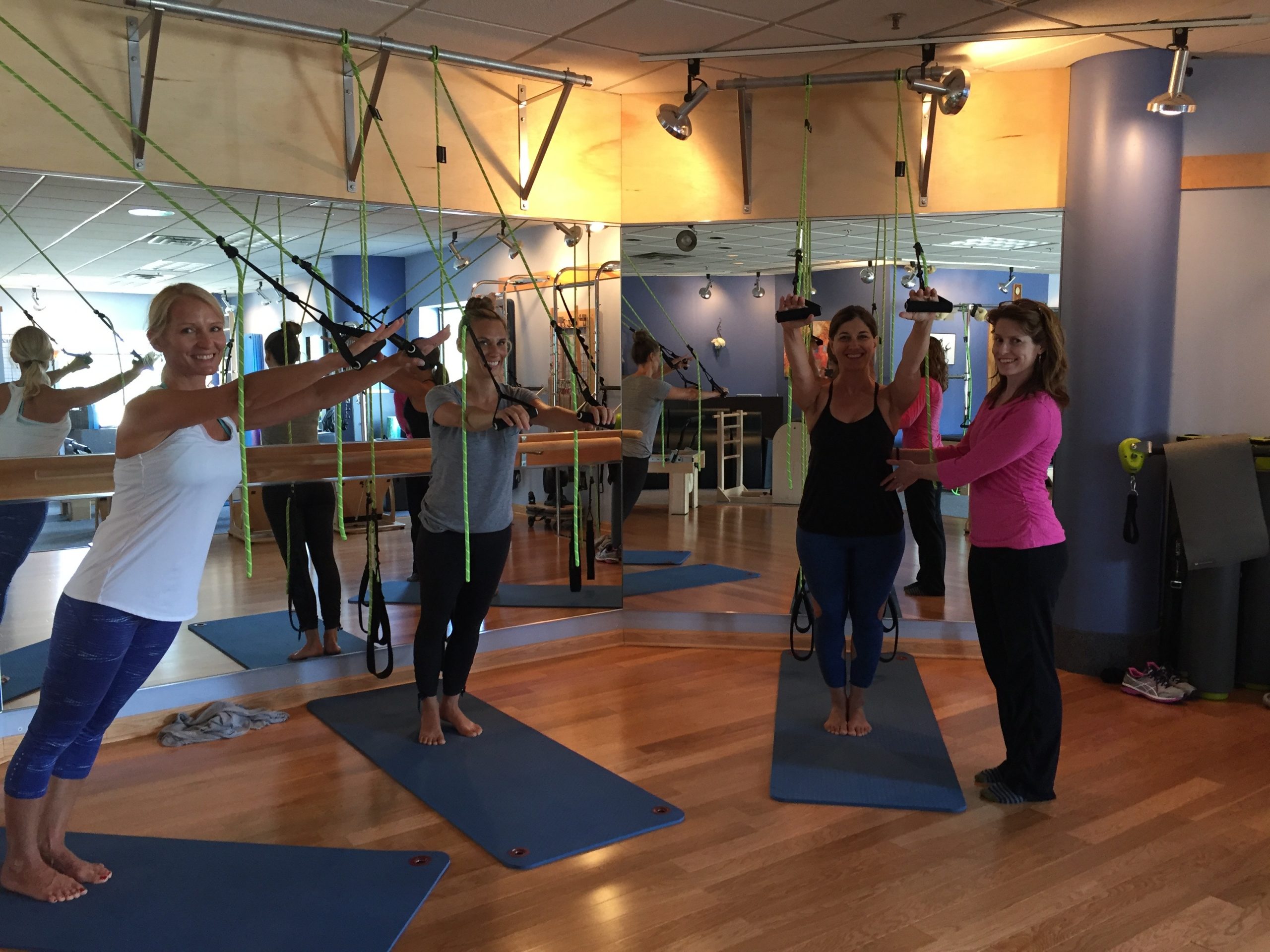 A group of students learning how to work out with elastic bands