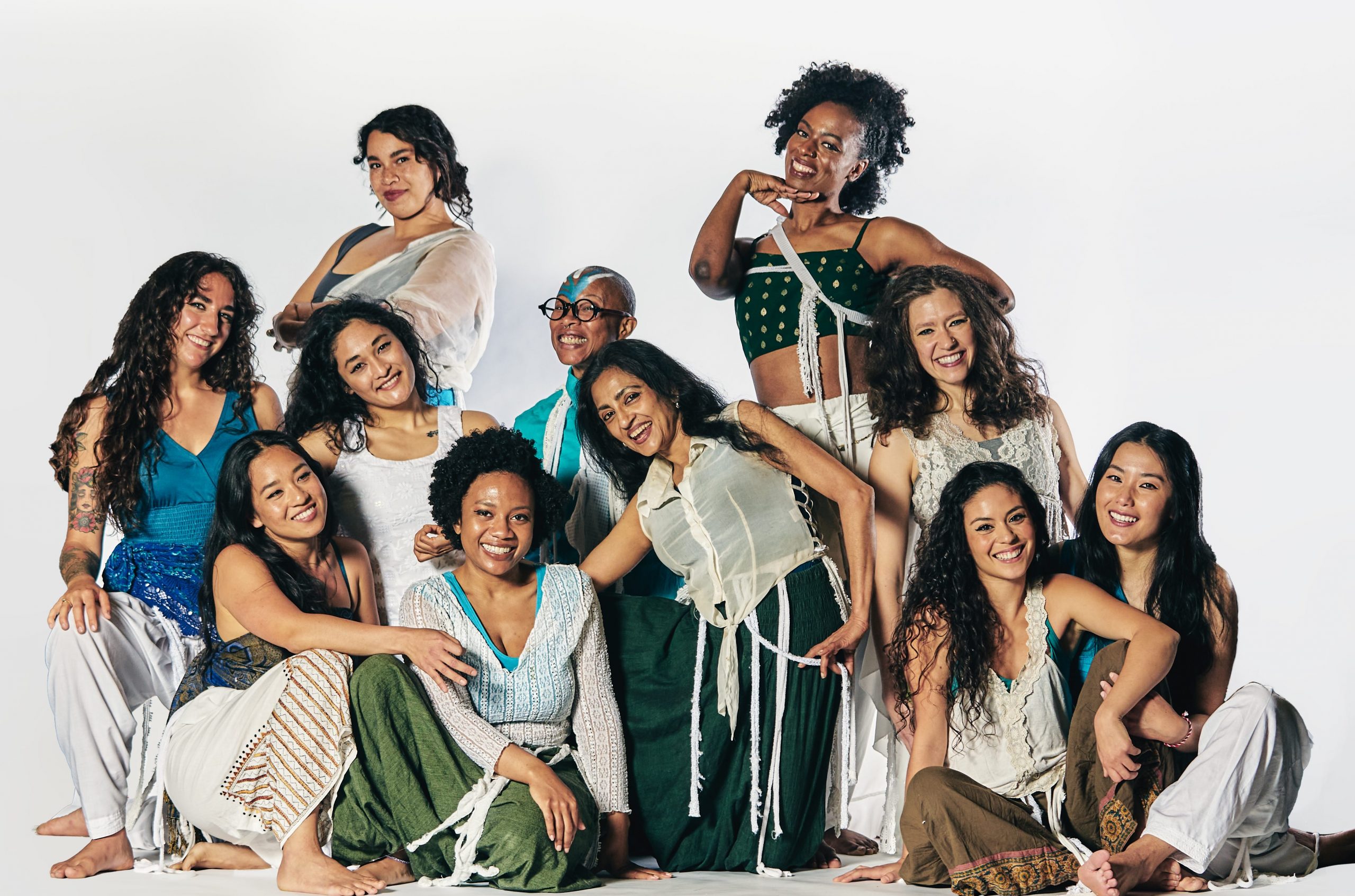 A photo of several women of color -members of Ananya Dance Theatre -smiling at the camera