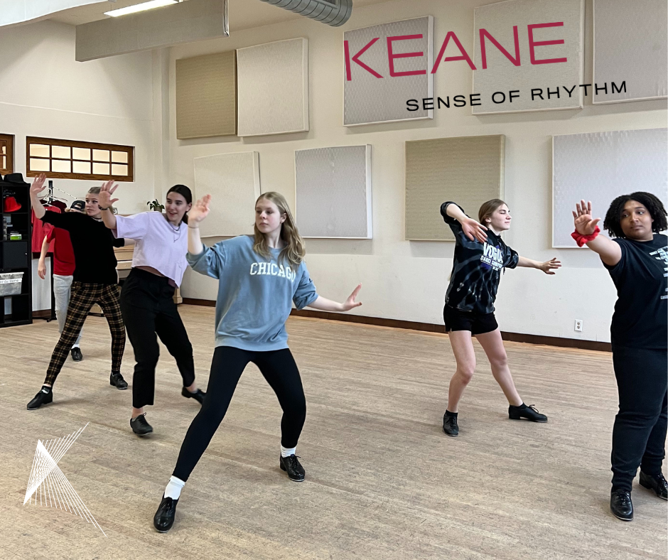 A group of youth dancers in tap shoes at rehearse in Studio K